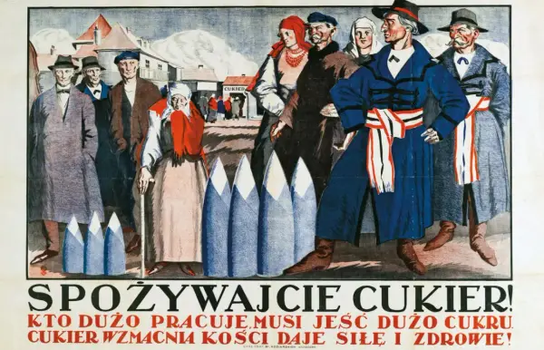 Ludzie w strojach z epoki, przed budynkiem z napisem "Cukier". Hasło "Cukier krzepi kto to powiedział" towarzyszy tej scenie.